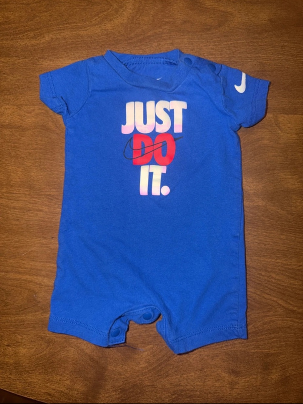 Nike Royal Blue Infant Onesie with White Swoosh and Red Accent